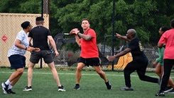 Col. Patrick W. Miller, commander of Bayne-Jones Army Community Hospital, prepares to throw a pass during the Army Heritage Month Ultimate Football Challenge 