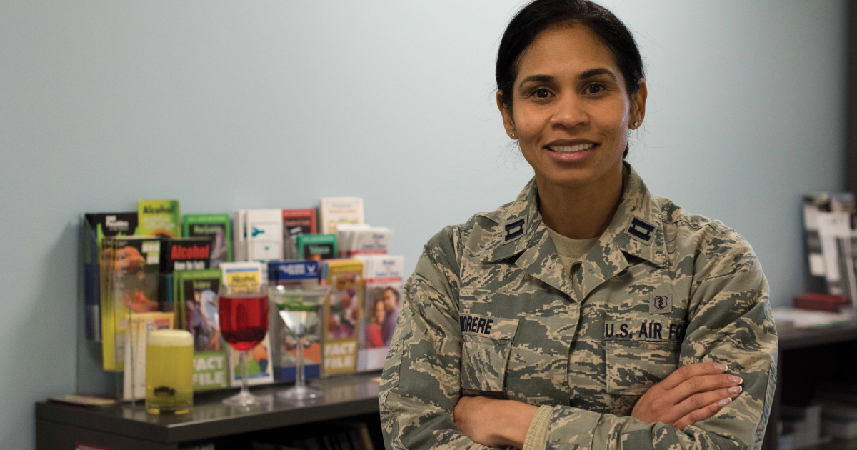 Social worker standing in front of products