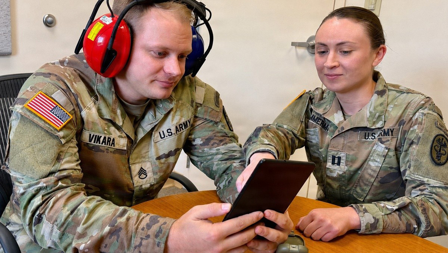 U.S. Army Capt. Annika Zimmerman, hearing program manager and audiologist at Bayne-Jones Army Community Hospital, conducts a hearing protection fit test using the Wireless Automated Hearing Test System