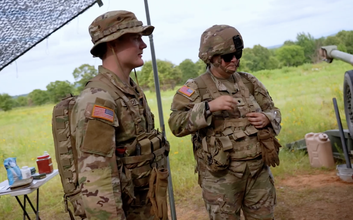 Army Spc. Gavyn Edwards, a combat medic assigned to 1st Battalion, 206th Field Artillery Regiment, 39th Infantry Brigade Combat Team, monitors hydration, nutrition, and overall condition, and teaches quick stretches to help prevent back injuries.
