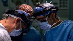 U.S. Air Force Maj. Matthew Van Hoof, right, 86th Dental Squadron oral and maxillofacial surgeon and Lt. Col. Matthew Wilson, 86th chief oral and maxillofacial surgeon, administers surgical treatment on a patient