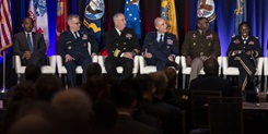 Uniformed Services University President Jonathan Woodson, U.S. Air Force Major General Paul Friedrichs, U.S. joint staff surgeon, U.S. Navy Surgeon General Rear Adm. Bruce Gillingham, U.S. Air Force Surgeon General Lt. Gen. Robert Miller, U.S. Army Surgeon General Lt. Gen. Scott Dingle, and Defense Health Agency Director U.S. Army Lt. Gen. Telita Crosland answer questions during a panel discussion on Feb. 14 during the 2023 AMSUS Annual Meeting in National Harbor, Maryland. The panel was titled, “Collaboration Across and Outside the MHS Today and Tomorrow.”