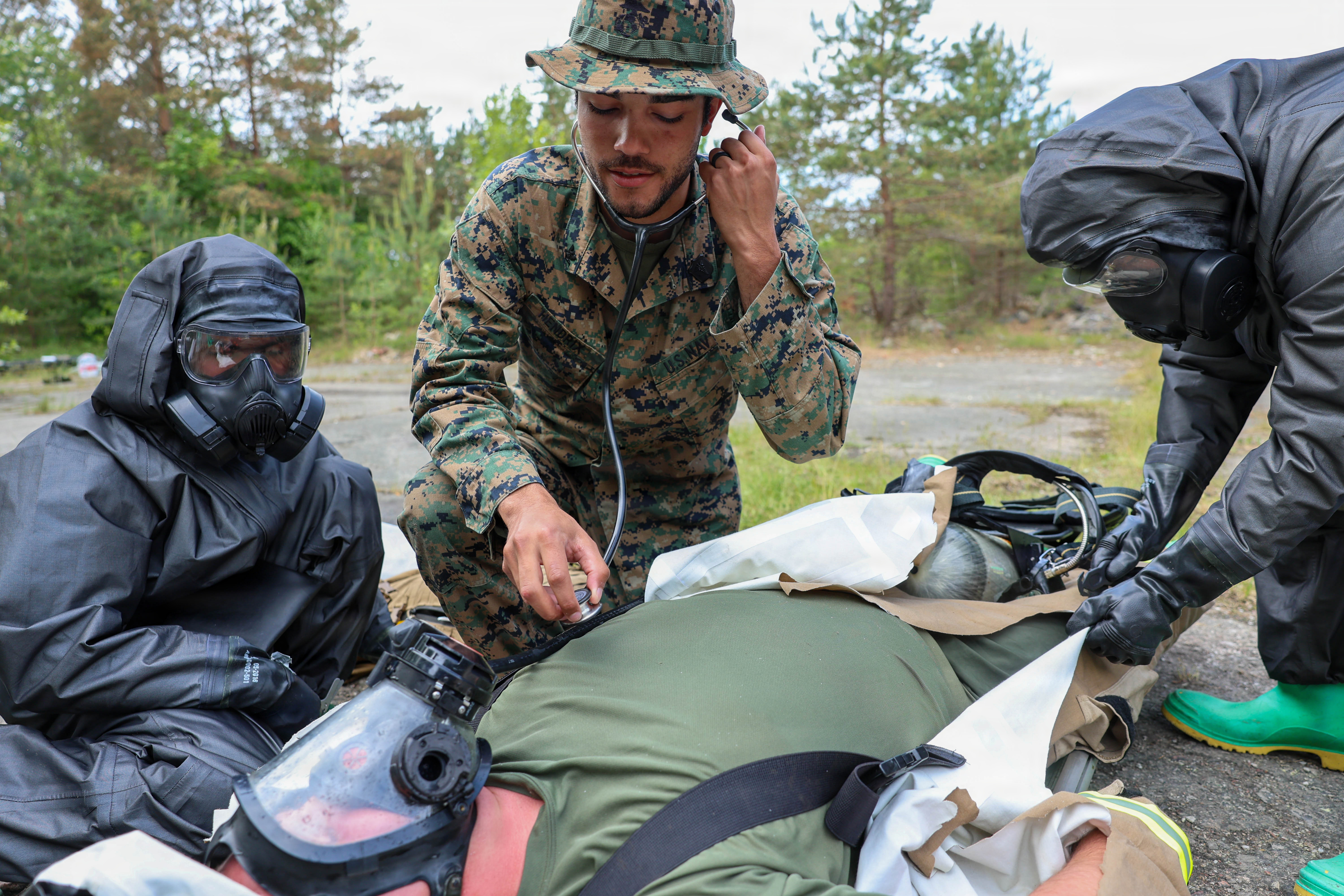 Corpsman checking vital signs