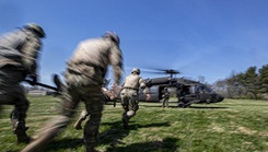 U.S. Army soldiers load a simulated patient on to a New Jersey National Guard UH-60L Black Hawk helicopter during a combat lifesaver course run by the Medical Simulation Training Center on Joint Base McGuire-Dix-Lakehurst, New Jersey, April 14, 2022. (U.S. Air National Guard photo by Master Sgt. Matt Hecht)