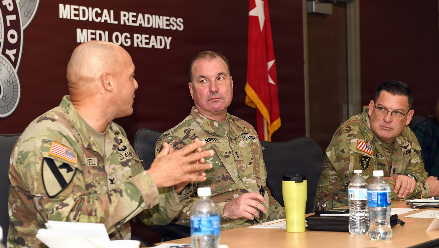 Image of Army leaders discuss MEDLOG transformation.
