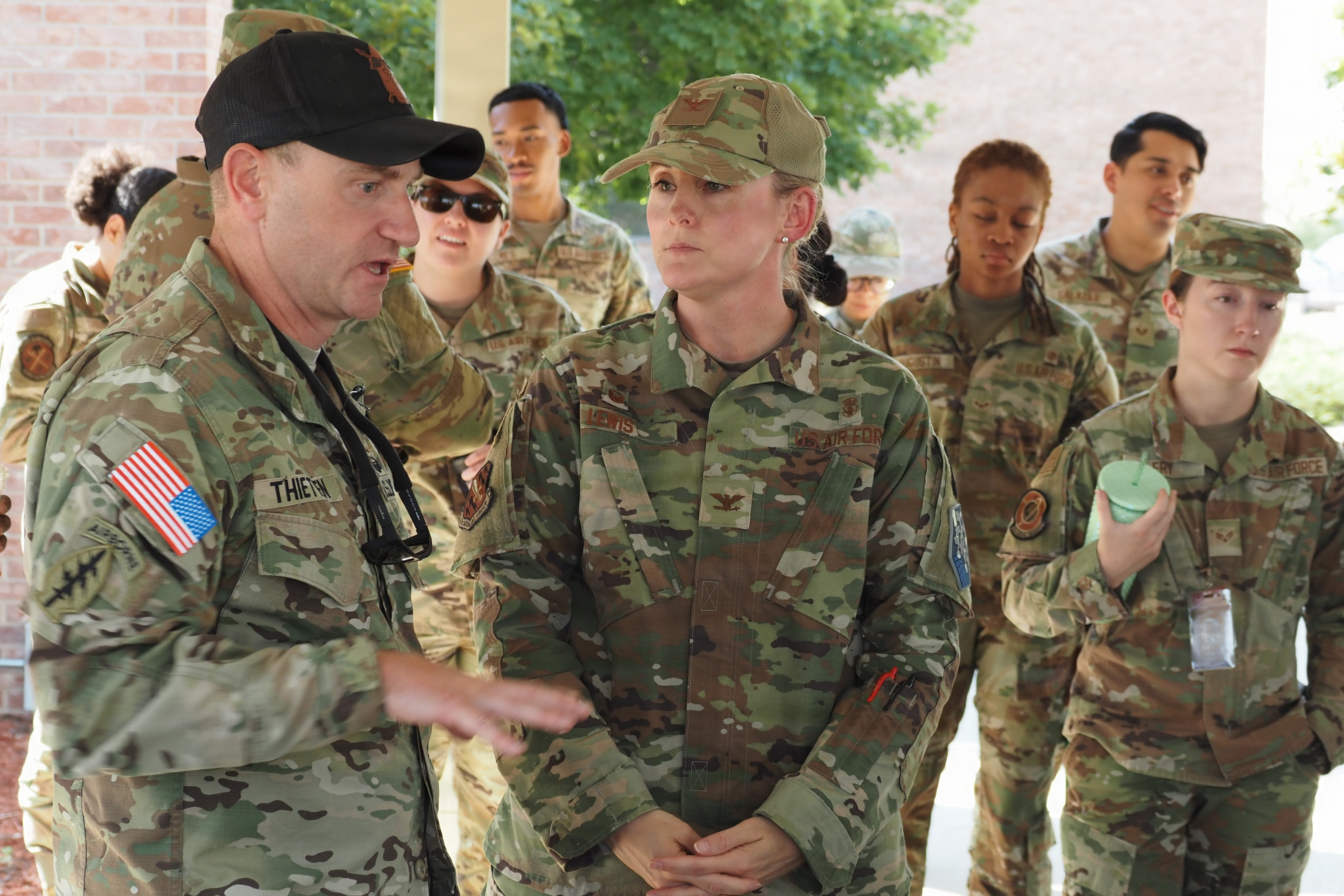 Image of Army expeditionary dentist shares combat casualty lessons with Air Force medics.