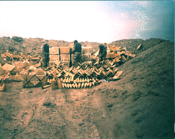 Figure 30.  Soldiers preparing munitions for demolition in a revetment; picture courtesy of Commander, 307th Engineer Battalion