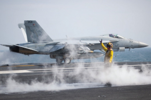 Jet taking off from aircraft carrier