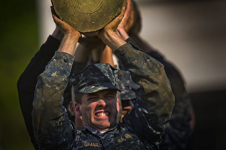 Image of Midshipmen from the U.S Naval Academy Class of 2016 conduct a log carrying exercise. Click to open a larger version of the image.