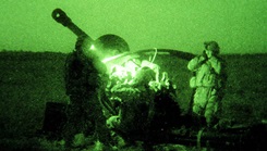 An Army 'gun team' brace for the concussion of a 105mm howitzer during operations in Iraq in 2008. (Photo: Master Sgt. Kevin Doheny)