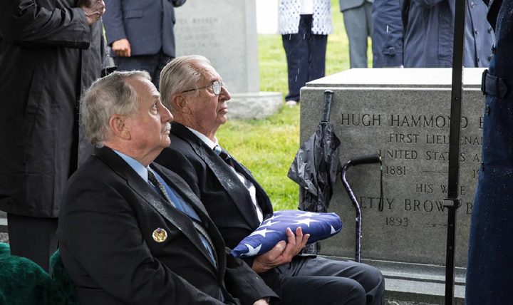 Air Force Lieutenant Colonel (ret.) Fred Hoblit (left) and Air Force Col. (ret.) Jerry Hoblit (right) sit graveside during services for their father, Air Force Col. Noel Elmer Hoblit, on May 21, 2015 at Arlington National Cemetery. 