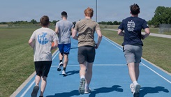 Airmen assigned to the 137th Special Operations Wing, Oklahoma Air National Guard, run on the Will Rogers Air National Guard Base track