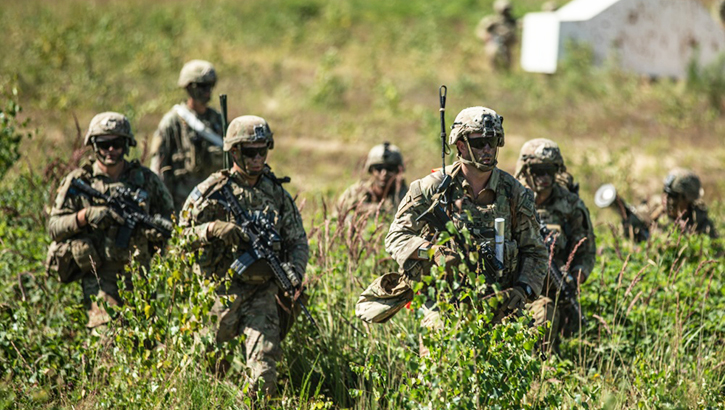 Image of Group of soldiers in a field. Click to open a larger version of the image.