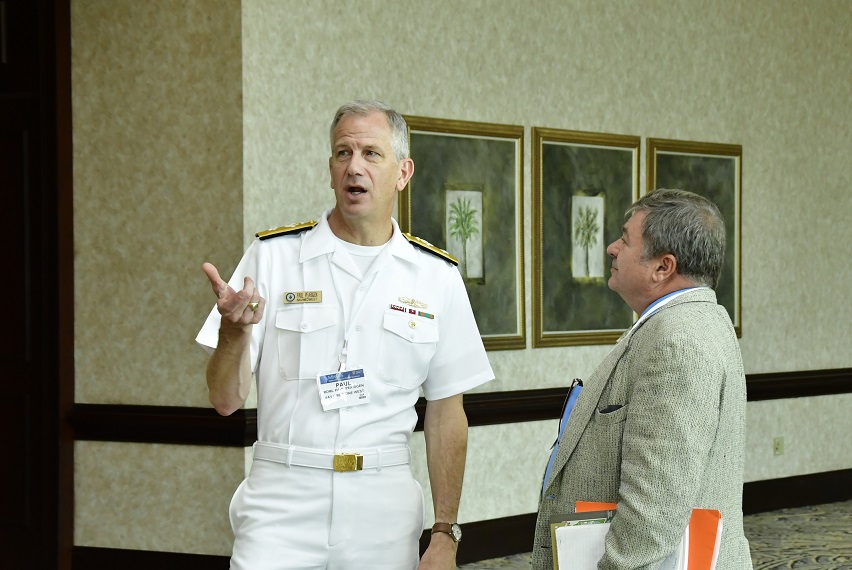 Rear Adm. Paul Pearigen, commander, Navy Medicine West (NMW) and chief of the Navy Medical Corps, and Dr. Kenneth Earhart, Naval Health Research Center’s (NHRC) science director, at the 2017 Military Health System Research Symposium (MHSRS). 