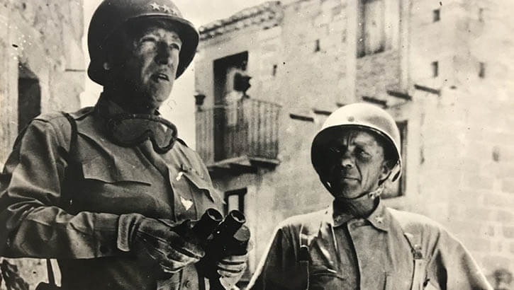 Lt. Gen. George S. Patton and Brig. Gen. Theodore Roosevelt Jr. are pictured here in 1943 wearing the standard M1 helmet, sometimes called the "steel pot." (Photo: 1st Infantry Division Courtesy Photo)