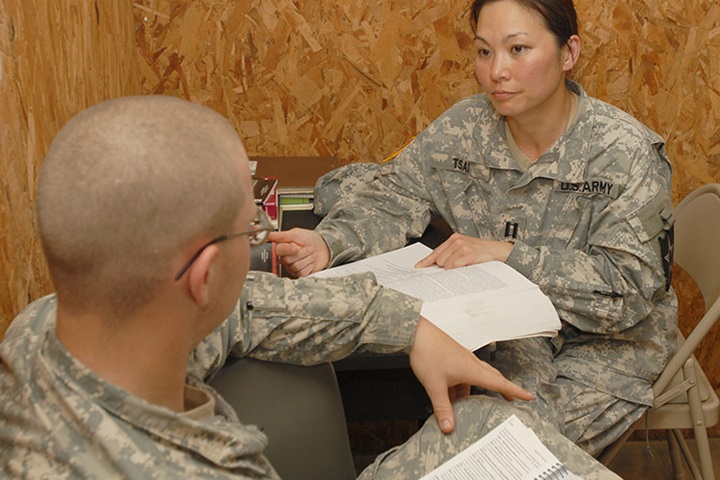 Image of Capt. Michelle Tsai, the behavioral health officer for the 4th Brigade, 2nd Infantry Division, reviews medical information in her office at the Joint Readiness Training Center June 17. Tsai, an Alexandria, Va., native, is here with the Raider Brigade in support of training operations for the unit's upcoming deployment to Iraq. (Photo by Pfc. Luke Rollins).