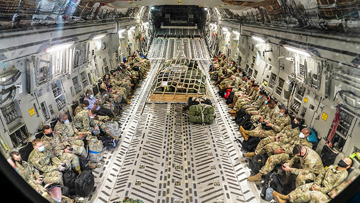 Image of An Air Force C-17 Globemaster III at Joint Base Pearl Harbor-Hickam, Hawaii, prepares to transport U.S. Army medical personnel to Guam in support of the global COVID-19 response on April 13, 2020. Click to open a larger version of the image.