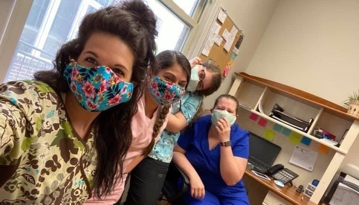 Four  military nurses wearing masks