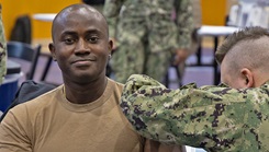 A Sailor receives an influenza vaccine during a mass vaccination event at the Fleet Recreation Center Gym on Commander, Fleet Activities Yokosuka