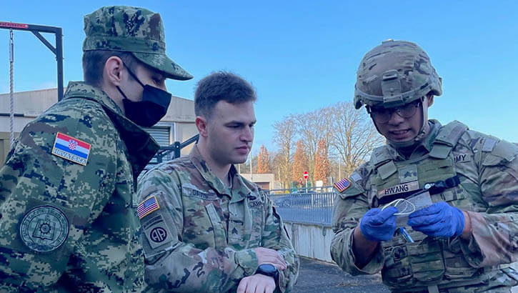Military personnel observing new medical training