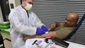 Military medical personnel donating blood