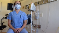 Military medical personnel in exam room