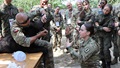 Military personnel in K( casualty care briefing 