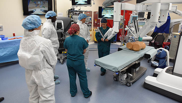 Image of Second Lt. Nina Hoskins, 81st Surgical Operations Squadron operating room nurse, briefs Col. Debra Lovette, 81st Training Wing commander, and other base leadership on robotics surgery capabilities inside the robotics surgery clinic at the Keesler Medical Center June 16, 2017. (Photo: Kemberly Groue, U.S. Air Force). Click to open a larger version of the image.