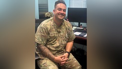 U.S. Air Force Tech. Sgt Zachary Lunn, noncommissioned officer in charge of apheresis, 379th Expeditionary Medical Squadron, smiles at his workstation at Al Udeid Air Base, Qatar