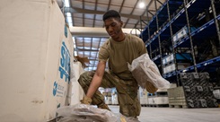 Air Force Airman 1st Class Caleb Morris, a 379th Expeditionary Logistics Readiness Squadron technician assigned to the Expeditionary Theater Distribution Center, organizes equipment