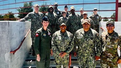 Col. Mary Carnduff (front left), Capt. Janiese Cleckley (front-center-left), Master Chief Richard Moreno (front-center-right), and staff assigned to the 412th Medical Group and Naval Hospital Twentynine Palms gather for a group photo