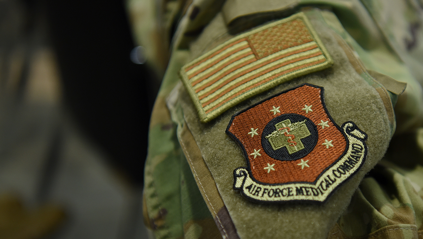 An Airman shows a patch during a ceremony formally recognizing the Air Force Medical Command at the Defense Health Headquarters