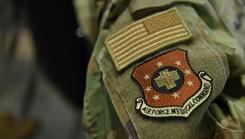 An Airman shows a patch during a ceremony formally recognizing the Air Force Medical Command at the Defense Health Headquarters