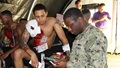 An Army soldier and patient actor sports a mock impalement while providing simulated medical information to test out a new electronic medical record system designed to virtually document medical encounters in the field. The mock scenario was part of the U.S. Navy’s Rim of the Pacific exercise in 2018. (Photo: Ana Allen, U.S. Army)
