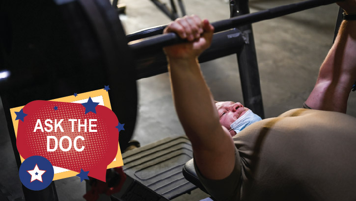 Image of Senior Airman Thomas McMurray with the 387th Expeditionary Support Squadron Force Protection prepares for a bench press at Al Mubarak Air Base, Kuwait, May 13, 2021 . Click to open a larger version of the image.