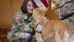  U.S. Army Brig. Gen. Deydre Teyhen, commanding general, congratulates U.S. Air Force Maj. McAfee, facility dog, upon his commissioning at Brooke Army Medical Center, Fort Sam Houston, Texas, June 6, 2023. McAfee is BAMC’s second official facility dog and the first to be commissioned into the U.S. Air Force. (DoD photo by Jason W. Edwards) 