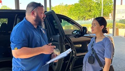 Jesse Olson, aviation safety officer and certified child passenger safety technician at the Joint Readiness Training Center and Fort Johnson, Louisiana discussed the proper installation of and conducted a safety seat inspection for Nahomi Ortiz during the Breastfeeding Awareness Month family health fair August 5, at Bayne-Jones Army Community Hospital.  (Photo: Jean Graves)