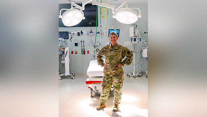 Military nurse poses for photo