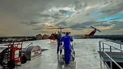 Medics move out to receive a patient from a 413th Flight Test Squadron UH-1 Huey in Gainesville, Florida