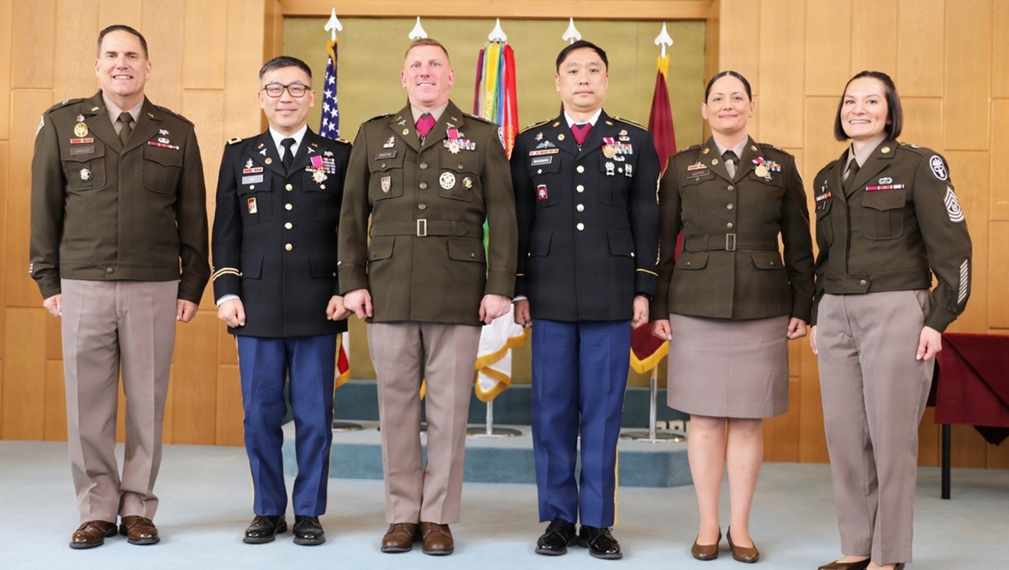U.S. Army Col. Jacob Gin, U.S. Army Col. Christopher Greene, U.S. Army Master Sgt. Peter Bassman and U.S. Army Staff Sgt. Julieann Hopper pose for a picture