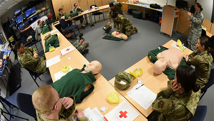 Image of Images of soldiers practicing CPR on dummies. Click to open a larger version of the image.