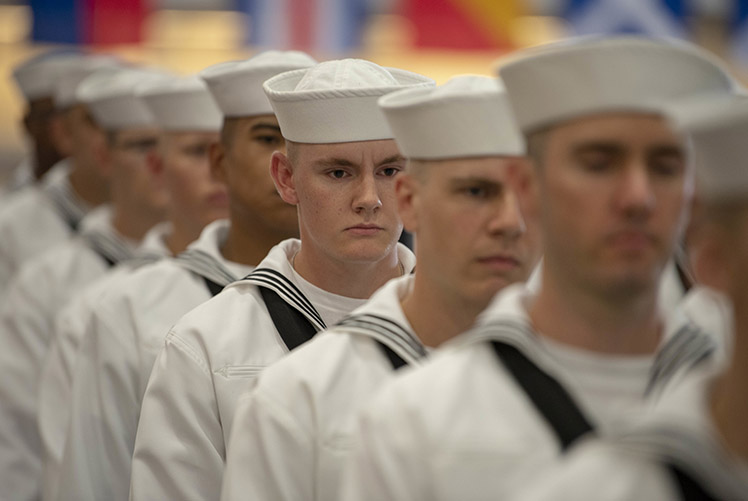 Image of U.S. Navy sailors graduate from boot camp at Recruit Training Command (RTC) in 2018. (Photo courtesy of U.S. Navy). Click to open a larger version of the image.