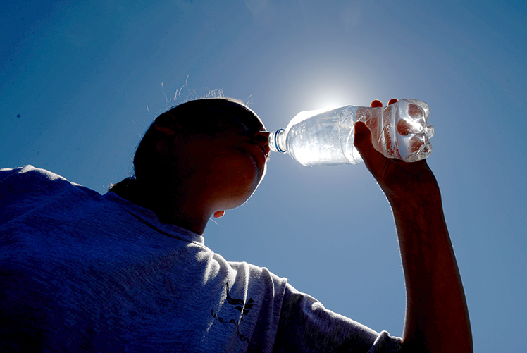 Image of Drink water the day before and during physical activity or if heat is going to become a factor. (Photo Courtesy: U.S. Air Force). Click to open a larger version of the image.