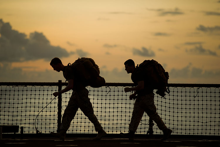Navy Lt. James E. Lamb, left, and Sgt. Ryan Eskandary exercise aboard USS Pearl Harbor, May 6. Lamb is a Minneapolis native and serves as a firepower control team leader. Eskandary hails from St. Paul, Minn., and serves as a forward observer. Both serve with the 11th Marine Expeditionary Unit’s command element. The unit embarked USS Makin Island, USS New Orleans and USS Pearl Harbor in San Diego, Nov. 14, beginning a seven-month deployment to the Western Pacific, Horn of Africa and Middle East regions. (U.S. Navy photo by Cpl. Tommy Huynh, Arabian Sea/Released)