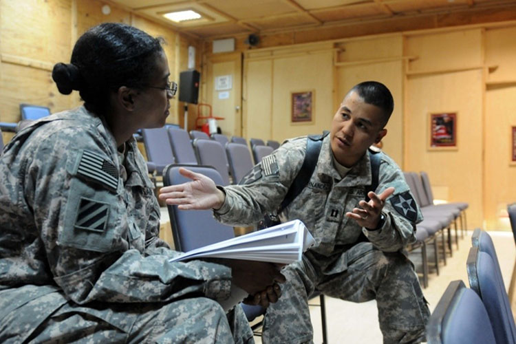  Capt. Elrico Hernandez, battalion physician assistant for 2nd Battalion, 3rd Infantry Regiment, 3rd Stryker Brigade Combat Team, 2nd Infantry Division, discusses a training scenario that is part of the first Primary Care Behavioral Health seminar. The new program is being undertaken by medical care providers throughout United States Division-North in order to provide better mental health screening for Soldiers