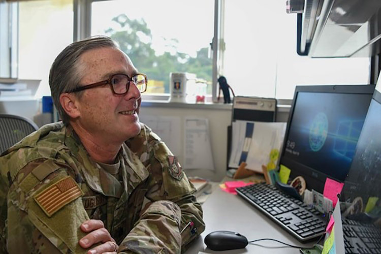 U.S. Air Force Lt. Col. Eric Oglesbee, the PACAF Pediatric Psychological Developmental Team child psychologist with the 18th Healthcare Operations Squadron, demonstrates how a telehealth appointment would operate at Kadena Air Base, Japan, April 19, 2021. Providing pediatric mental health support to five overseas Air Force bases, P3DT uses both virtual and in-person. (U.S. Air Force photo by Airman 1st Class Anna Nolte)