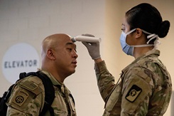 SEATTLE, WA, UNITED STATES 04.05.2020 U.S. Army Maj. Neil Alcaria is screened at the Seattle Event Center in Wash., April 5. Soldiers from Fort Carson, Colo., and Joint Base Lewis-McChord, Wash. have established an Army field hospital center at the center in support of the Department of Defense COVID-19 response. U.S. Northern Command, through U.S. Army North, is providing military support to the Federal Emergency Management Agency to help communities in need. (U.S. Army photo by Cpl. Rachel Thicklin)