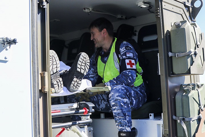 Image of Flight Lt. Michael Campion, an aviation medical officer from No. 3 Aeromedical Evacuation Squadron prepares a medical patient leaving Exercise Talisman Sabre to be transferred to a C-27J Spartan aircraft July 18, 2019 at Rockhampton Airport. No. 3 Aeromedical Evacuation Squadron is providing medical support to troops participating in Talisman Sabre 2019, a bilateral combined Australian and United States exercise designed to train respective military services in planning and conducting Combined and Joint Task Force operations, and improve the combat readiness and interoperability between Australian and US forces. (U.S. Army photo by Sgt. 1st Class John Etheridge).