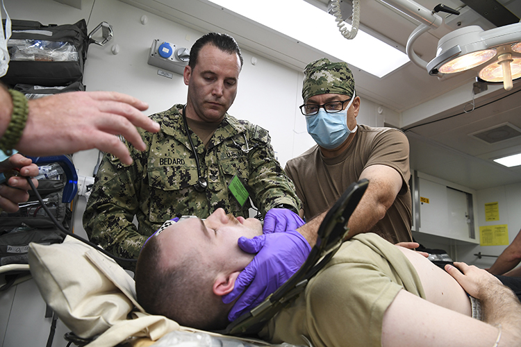 Service members assigned to Expeditionary Resuscitative Surgical System 19 prepare medical supplies aboard Royal Fleet Auxiliary ship Cardigan Bay during exercise Azraq Serpent 18. (U.S. Navy photo by Mass Communication Specialist 2nd Class Kevin J. Steinberg)