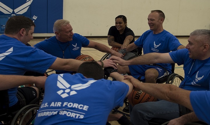 Mark Shepherd, Air Force Wounded Warrior wheelchair basketball head coach, gathers wounded warriors for a team hand stack during the Air Force Wounded Warrior (AFW2) Program Warrior Care event, at Joint Base Lewis-McChord, Wash., recently.